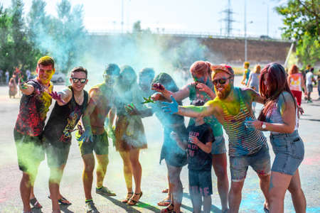 Happy people with paint on clothes having fun together at Holi festival. Russia, Rostov-on-Don, August 18, 2018のeditorial素材