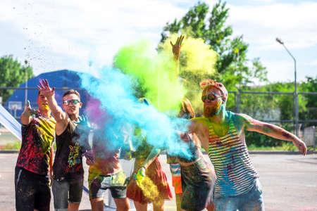 Young people throw colorful paints. Festival of paints.Russia, Rostov-on-Don, August 18, 2018