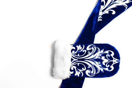 Merry Christmas concept background with blue glove on white background .happy new year flat lay
