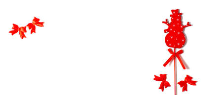 Merry Christmas. Red snowman with bows on white background, happy new year, flat lay, bannerの写真素材
