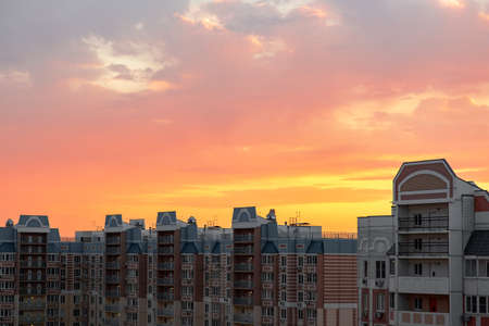 Sunset in bright pinks and oranges. Modern new buildings at sunset.Skyscraper and sky viewの写真素材
