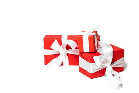 Christmas concept. Christmas gifts wrapped in red paper on a white isolated background.の写真素材