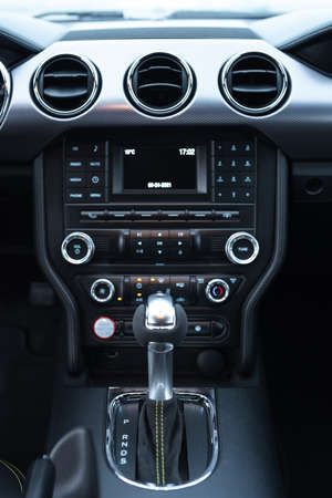 Muscle car Ford Mustang. The interior of the salon. Close-up of the gear shift knob. Russia,...