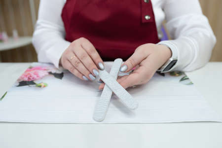 Woman getting manicure procedure in spa salon. Beautiful female hands.Hand care. cosmetic proceduresの写真素材