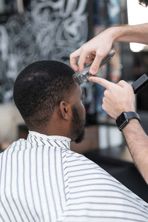 African American in a stylish barbershop. beauty and fashion conceptの写真素材
