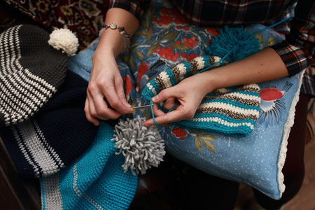 hand of a woman who crochet beanie warm of colored woolの写真素材