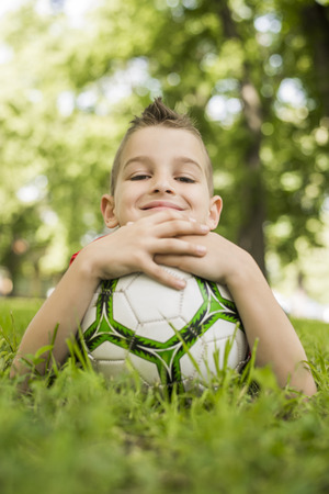 A young boy loves his soccerの写真素材