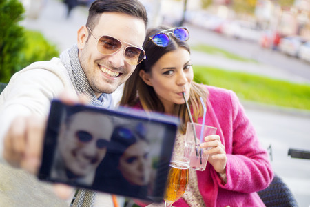 Cropped shot of an affectionate young couple taking a selfie.の写真素材