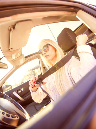 Young woman in her car.の写真素材