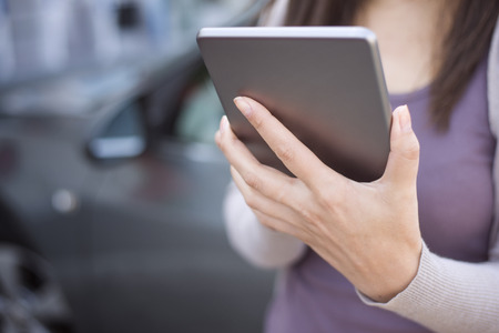 Woman using smart phone and call the car insurance
