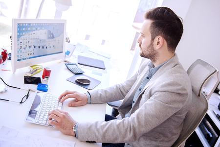 Businessman working on his laptop in the office