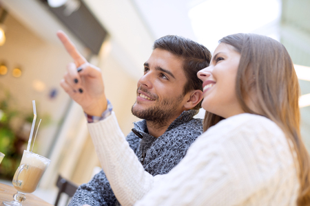Closeup portrait of a romantic young couple.Beautiful couple having fun in shopping mall.の写真素材