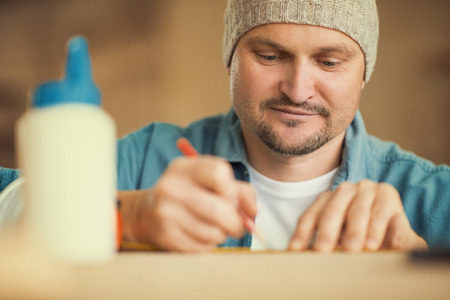 Carpenter at work.Getting the measurements right.の写真素材