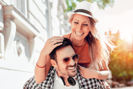 Smiling couple in love outdoors.Young happy couple hugging on the city street.の写真素材