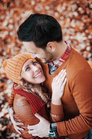 Young couple in love outdoor.Loving couple smiling and enjoying the autumn season.の写真素材