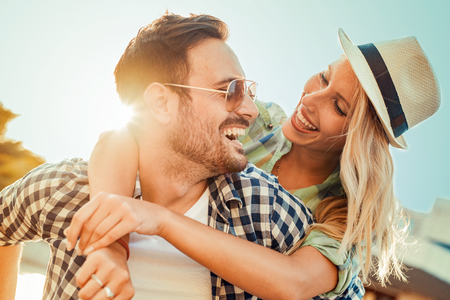 Cheerful couple having fun on summer vacation.の写真素材