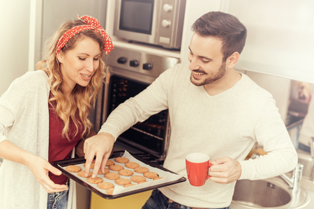 Happy couple making cookies at home.Family,food,hapiness and people concept.の写真素材