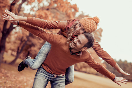 Couple in love in autumn.Smiling young couple hugging in the park.の写真素材