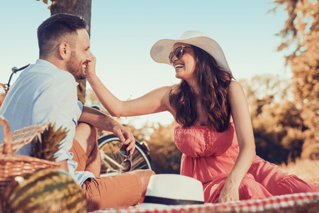 Shot of a beautiful couple on a picnic in the park.の写真素材