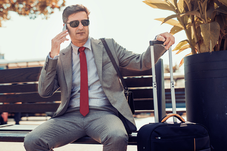 Portrait of a businessman in a train station.の写真素材