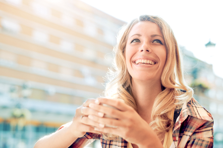 Portrait of attractive young woman drinking coffee.の写真素材