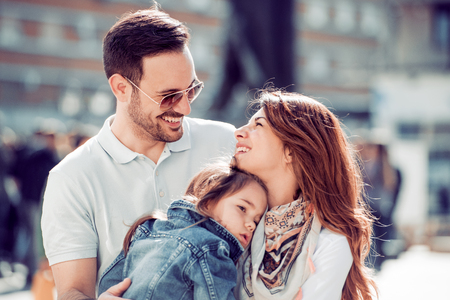 Happy family having fun outdoors and smiling.の写真素材
