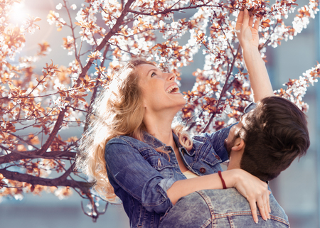 Young loving couple on natural background in the spring.の写真素材