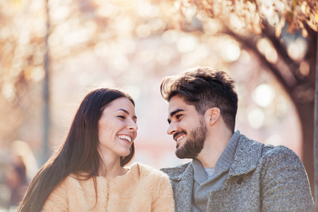 Happy young couple having fun outdoors and smiling.の写真素材