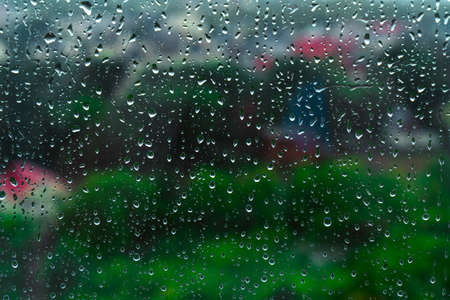 drops of water on glass on a cloudy day