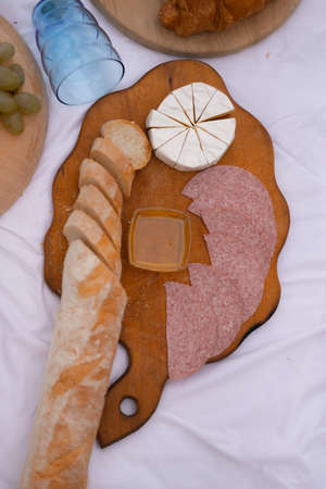 Beautiful autumn picnic on the lake at sunsetの写真素材