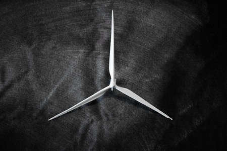 Wind turbine on a black background. Wind energy converter