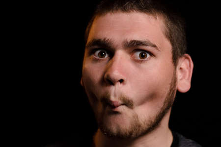 The man closed his lips tightly so as not to say anything