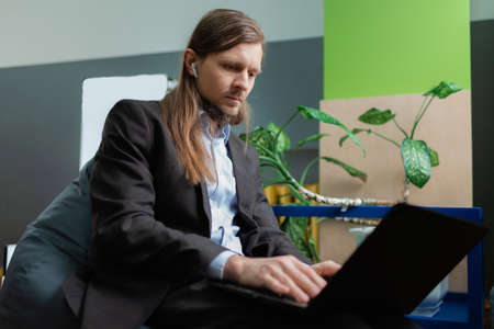 A man attending an online meeting in office