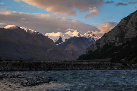 Beautiful evening landscape with high mountain, trees and shadowの写真素材