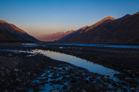 Beautiful evening landscape on sunset with river and mountainsの写真素材