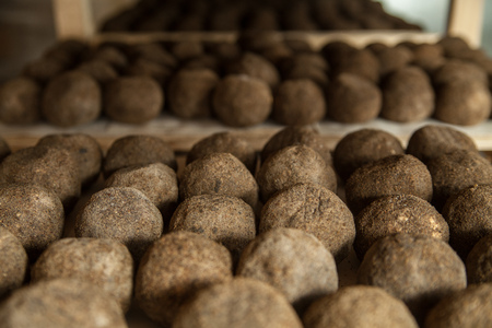 Cheese factory production shelves with aging cheeseの写真素材