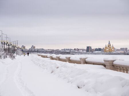 NIZHNY NOVGOROD, RUSSIA - February, 21nd, 2019: Winter view of Cathedral Church and Nizhny Novgorod stadium built for football world cup 2018 in Russiaのeditorial素材