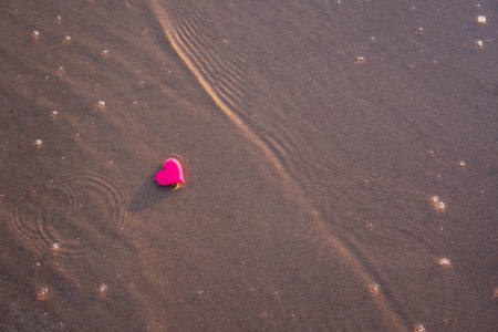 love symbol of heart on the sea beachの写真素材
