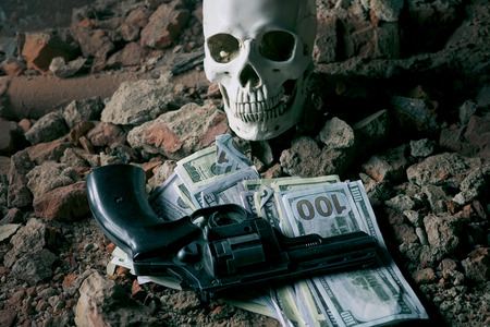 money and a revolver near the skull. Criminal conceptの写真素材