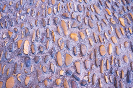 Abstract stone wall or small pebbles texture background.の写真素材
