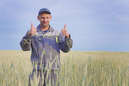 young farmer near a rye field. copy spaceの写真素材
