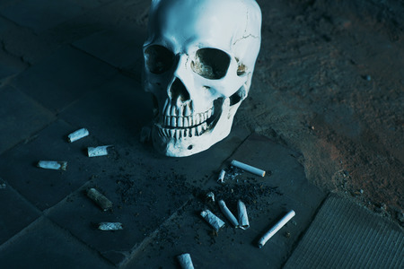 Smoking kills concept, portrait of a smoking skullの写真素材