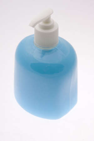 Bottle filled with blue liquid soapの写真素材