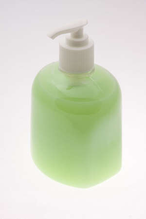 Bottle filled with green liquid soapの写真素材