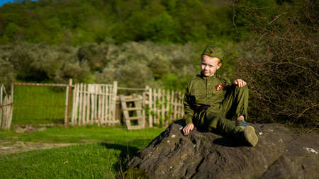 Children in military uniform of the USSR, Military children, Child soldiers, Children in nature, A girl and a boy in military uniformの写真素材
