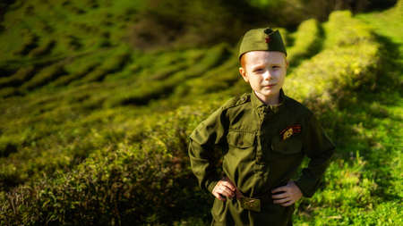 Children in military uniform of the USSR, Military children, Child soldiers, Children in nature, A girl and a boy in military uniformの写真素材