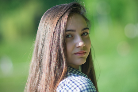 Bust portrait of a girl with a turned headの写真素材