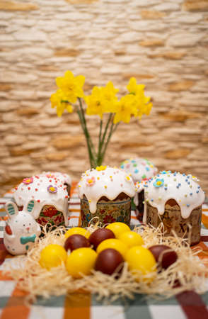 Festive Easter table with Easter cakes and eggsの写真素材
