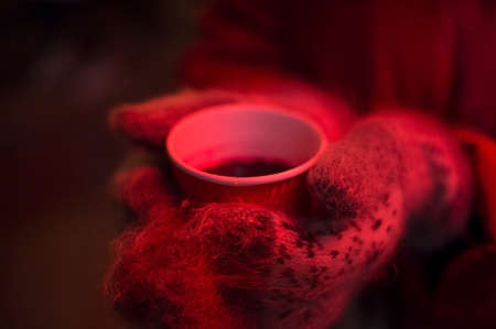 girl holding a cup of hot drinkの写真素材