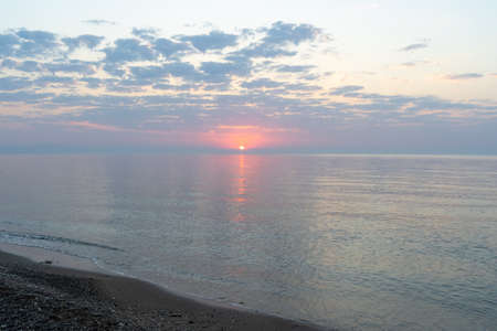 Gentle dawn over the sea coastの写真素材